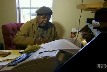 Ernest Gaines at his writing desk in 2013