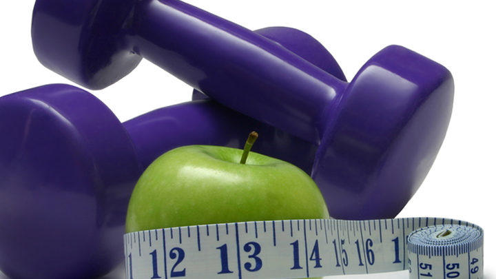 Picture of Weights, an apple, and a tape measure